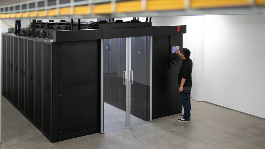 Man typing on a control panel in MyHost's datacentre.